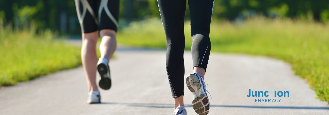 Jogging pictured from the waist down, outside on a pavement path