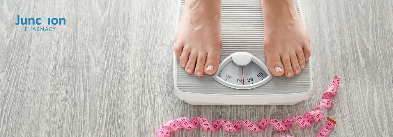 Woman standing on weighing scales