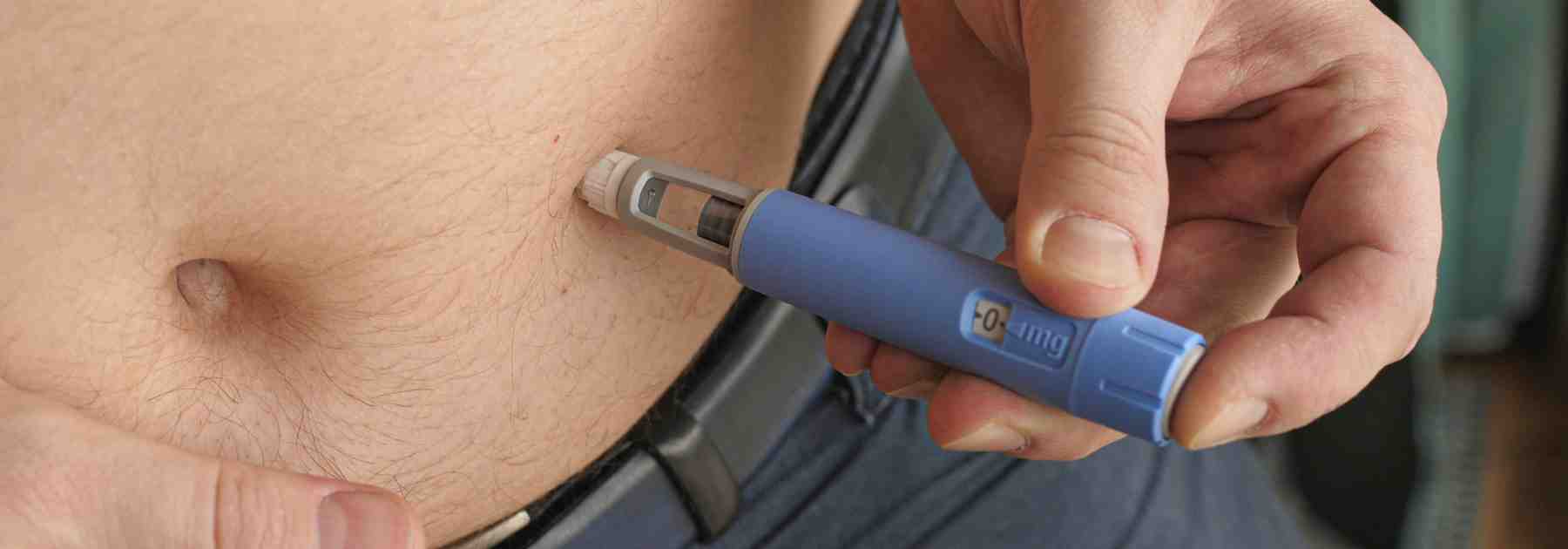 Weight loss pen dose being injected