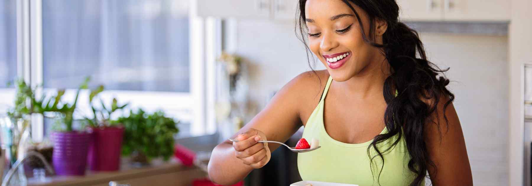 Woman enjoying healthy food to lose weight