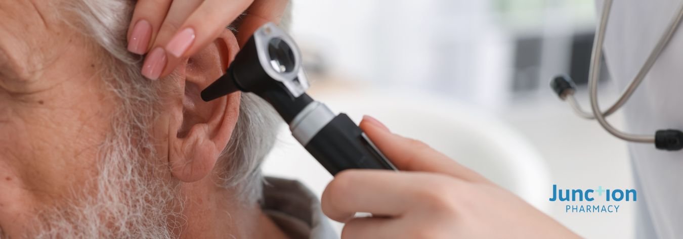 Man getting a hearing check, pictured close