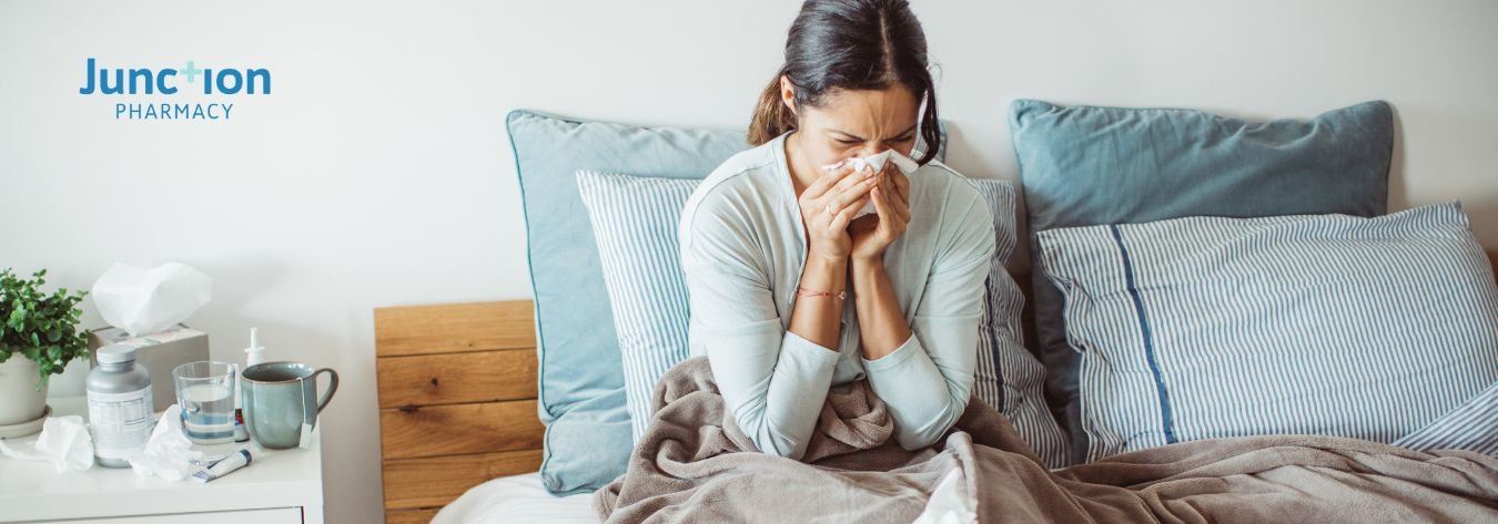 Woman in bed struggling with flu symptoms 