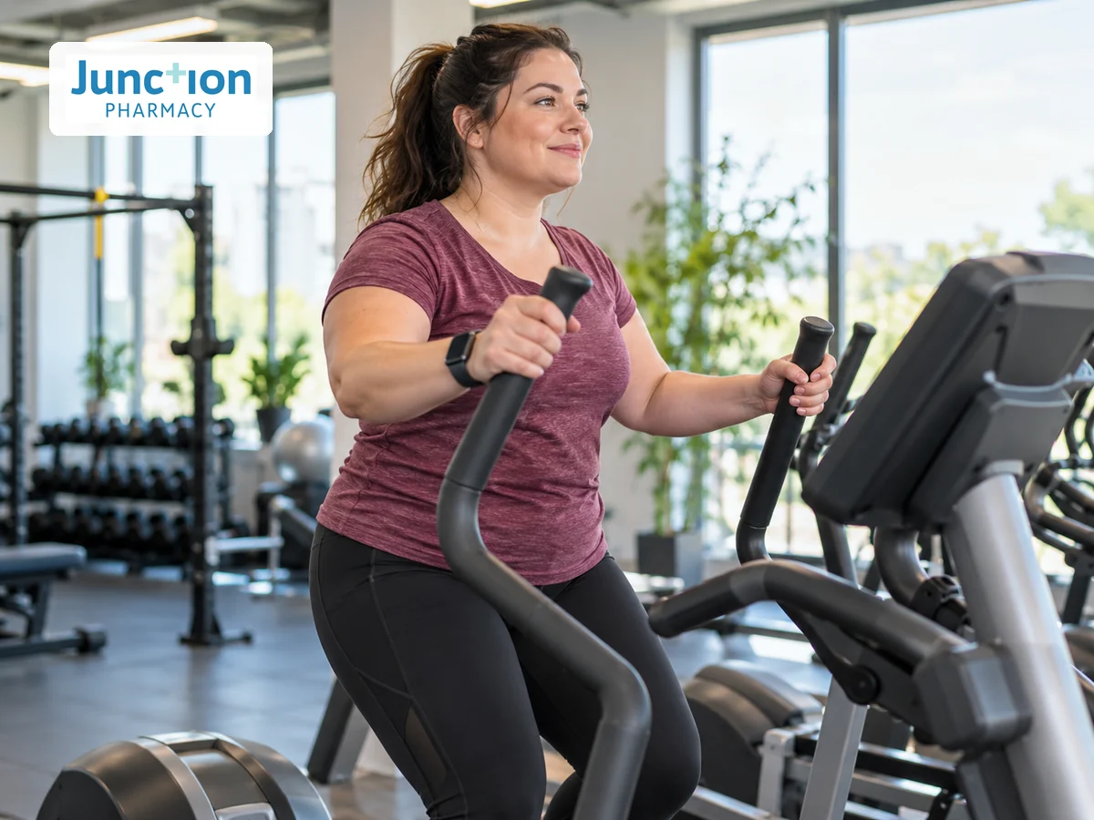 Woman exercising on an elliptical trainer in a gym